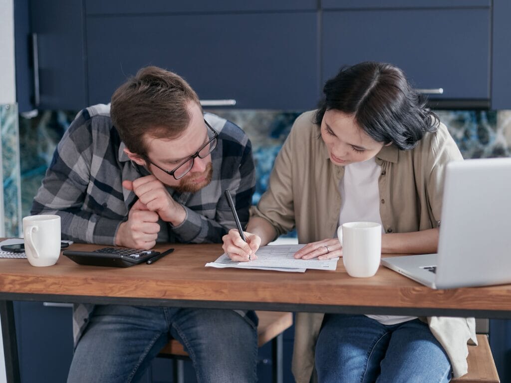 Homebuyers reviewing finances and mortgage credit