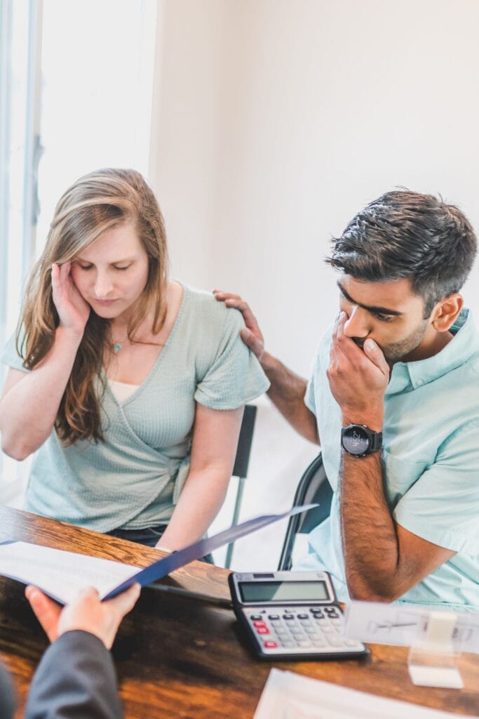 Homebuyers reviewing mortgage and credit information