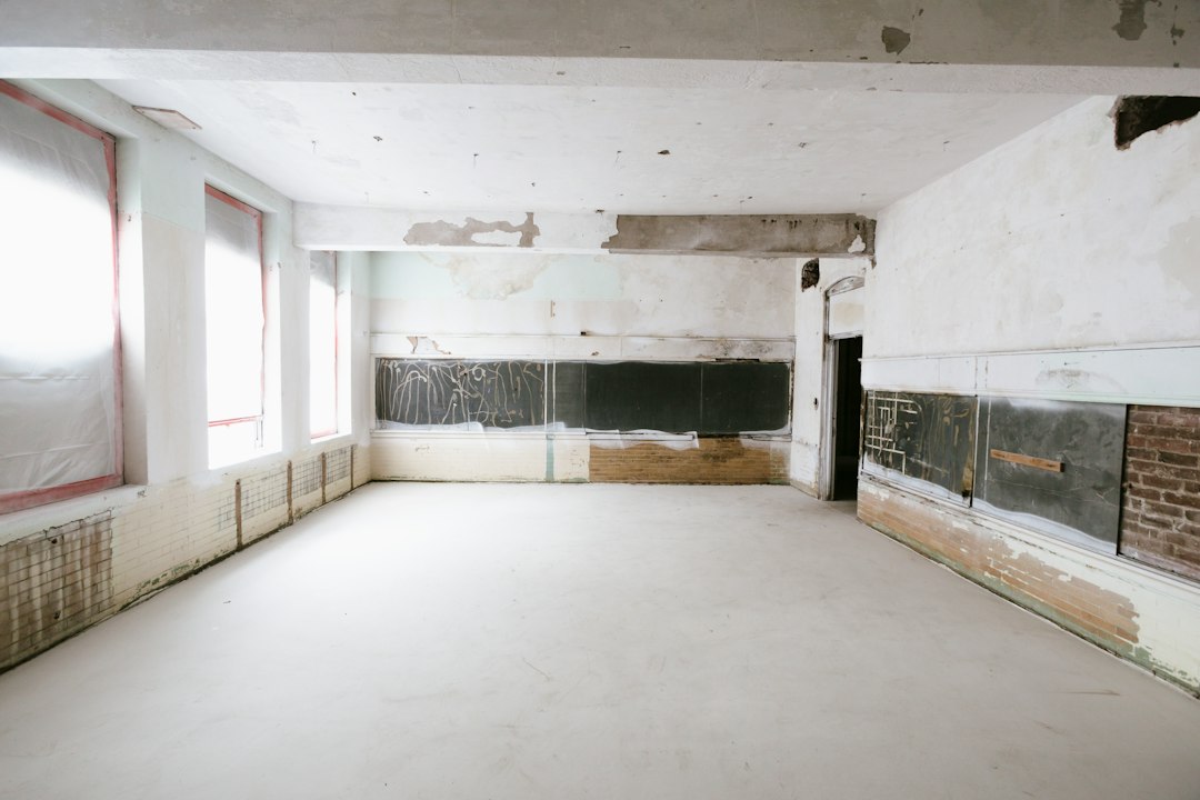 An unfinished room with exposed wall framing during a home renovation